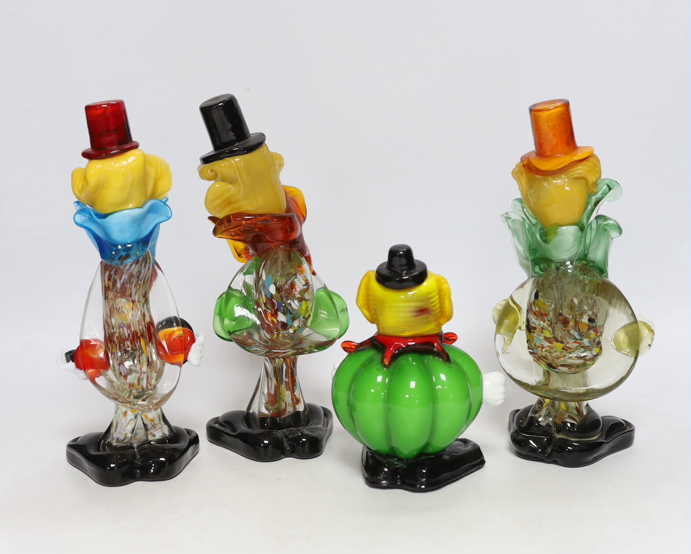 Four Murano glass clowns, largest 22cm high